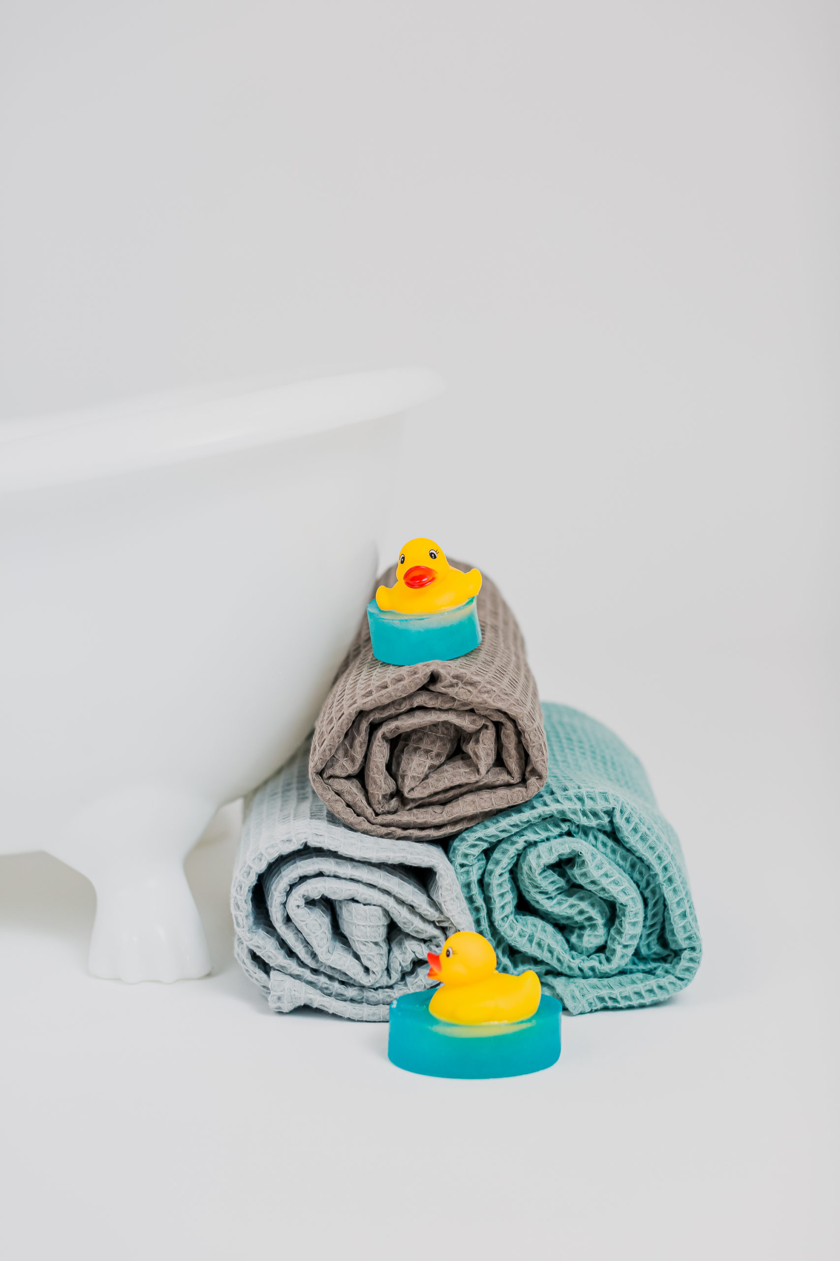 Duck Bath Toy on Top of Towls