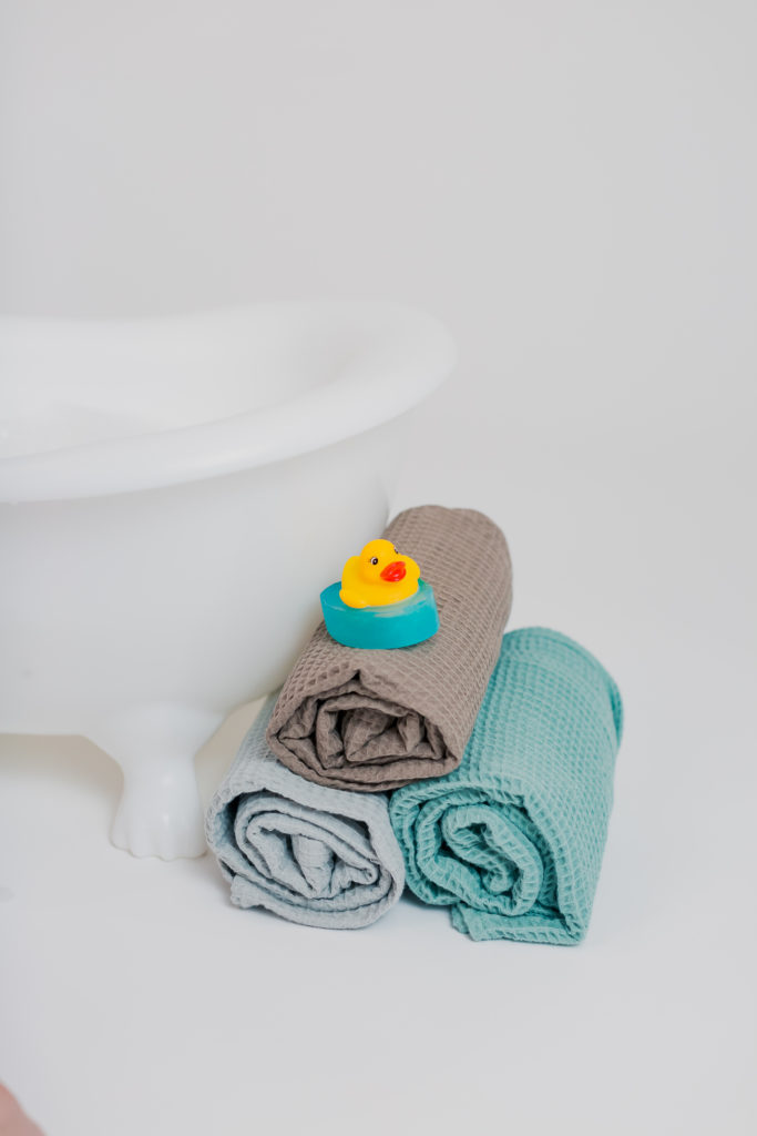 Duck Bath Toy on Top of Towls