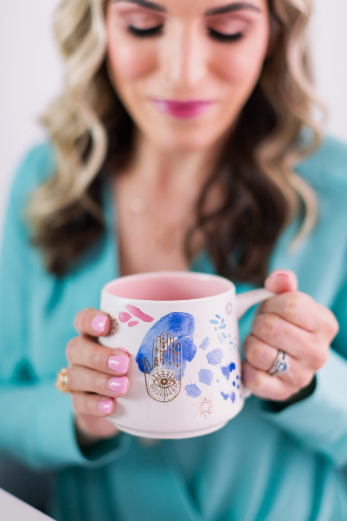 Woman Holding Warm Cup of Coffee