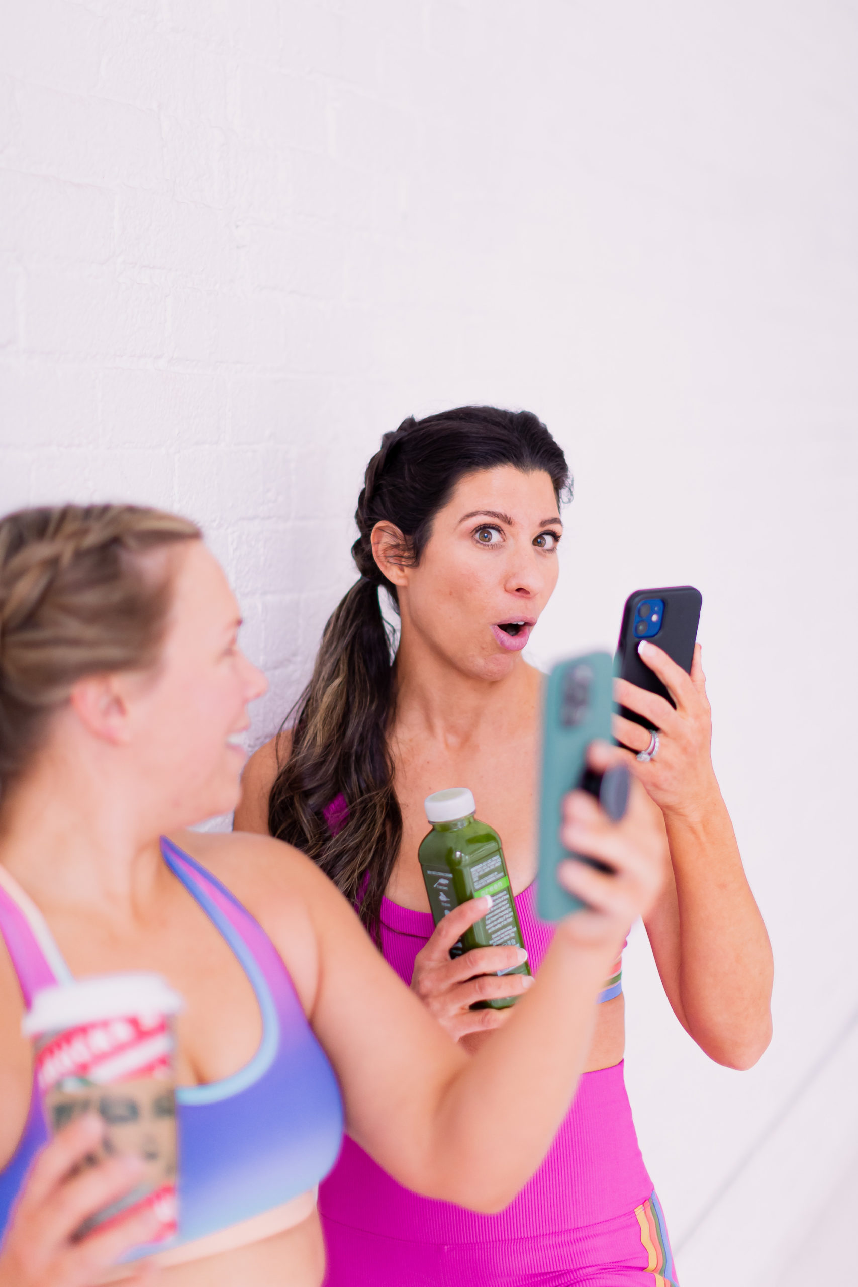 Woman in Workout Gear Looking at Phone