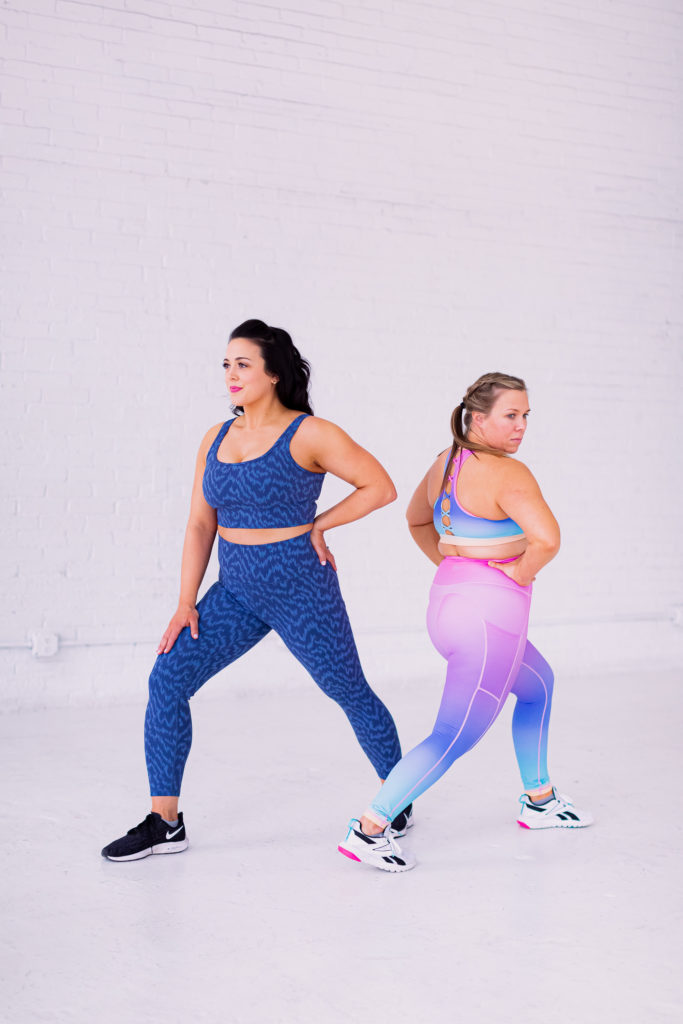 Two Women in Fitness Clothing Lunging in Opposite Directions