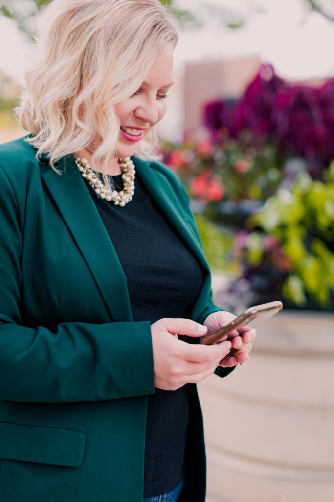 Smiling Woman in Glamorous Business Attire on Phone