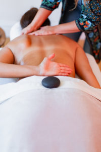 Woman giving a massage to another woman