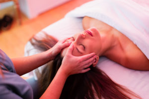Woman giving a massage to another woman