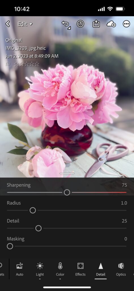 Screenshot of flower product photos being sharpened in lightroom mobile app
