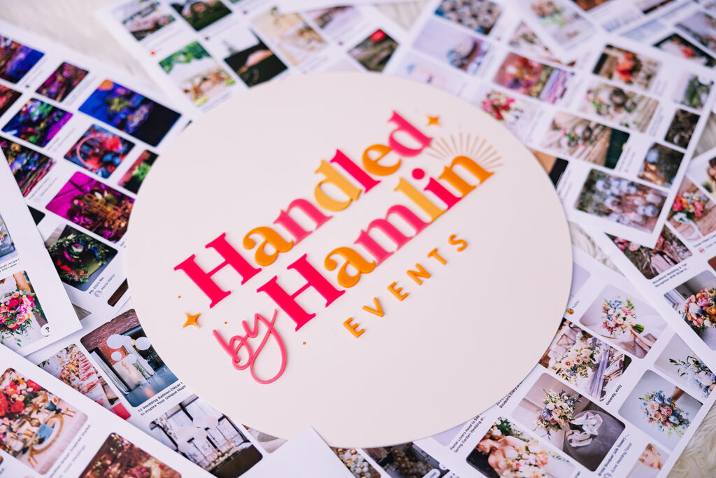 Vibrant and fun brand photo of mood boards behind a branded logo board for Handled by Hamlin Events, taken by This Way to Fabulous
