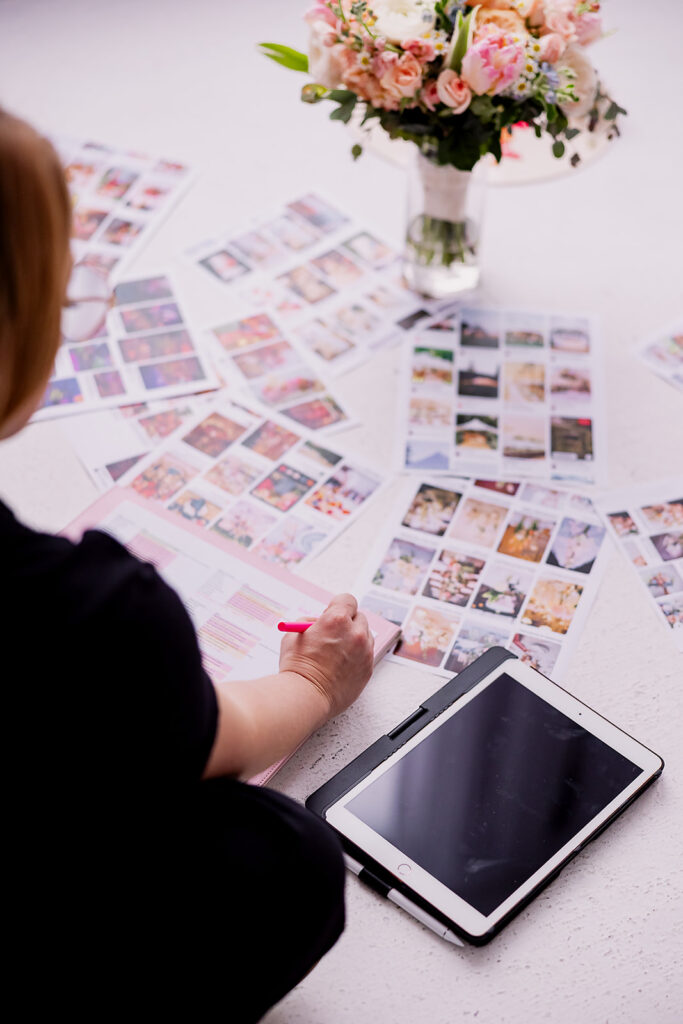 Vibrant and fun brand photo of a woman sitting surrounded by checklists, a tablet, balloons, and mood boards, taken by This Way to Fabulous