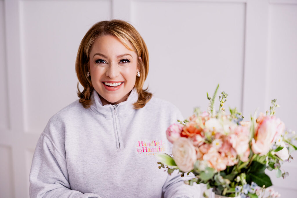Vibrant and fun brand photo of a woman with a bouquet of flowers, taken by This Way to Fabulous