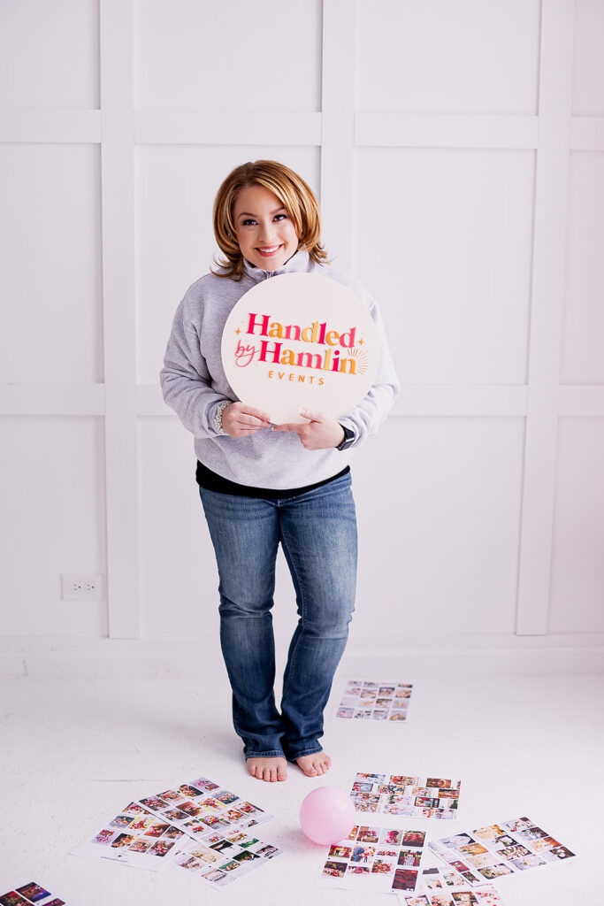 Vibrant and fun brand photo of a woman holding a logo sign, taken by This Way to Fabulous