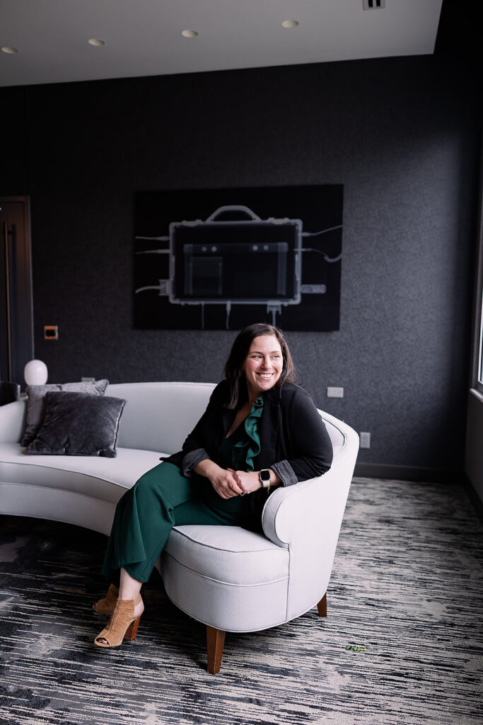 woman sitting on sofa in office for a branding photo