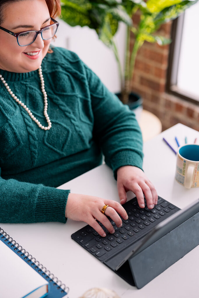 writer typing at her tablet
