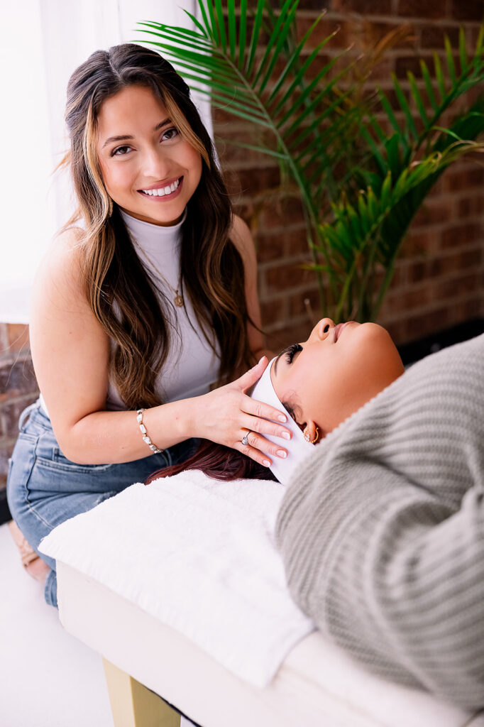 Branding detail image of a brunette woman getting ready to give a client lash extensions