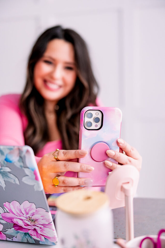 personal branding photo of Jacquelin Castillo of Mom Like a Boss creating content on her phone photographed by This Way to Fabulous