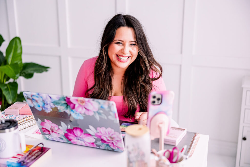 personal branding photo of Jacquelin Castillo of Mom Like a Boss wearing pink in a cheerful office setting photographed by This Way to Fabulous