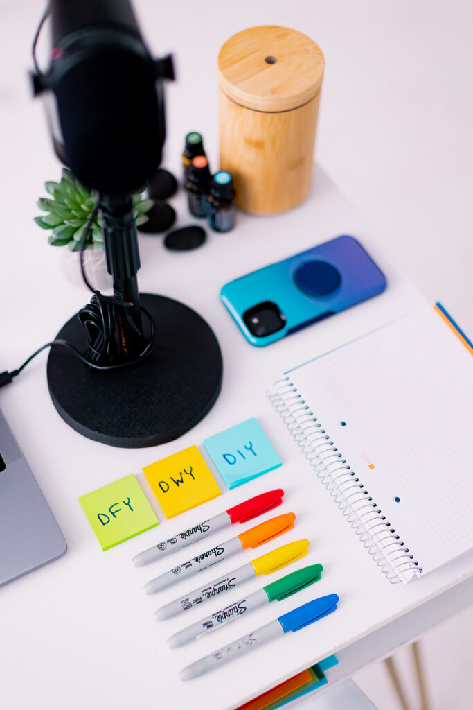 Brightly colored office supplies and a microphone in Google Educator colors at a professional organizer branding photoshoot by This Way to Fabulous