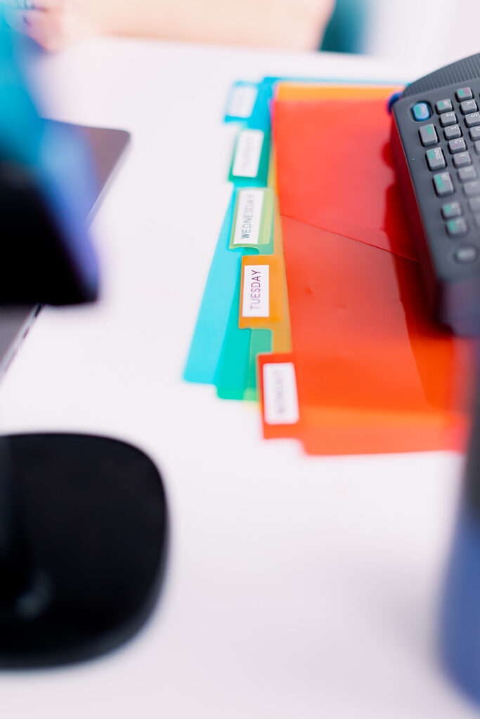 Brightly colored office supplies in Google Educator colors at a professional organizer branding photoshoot by This Way to Fabulous